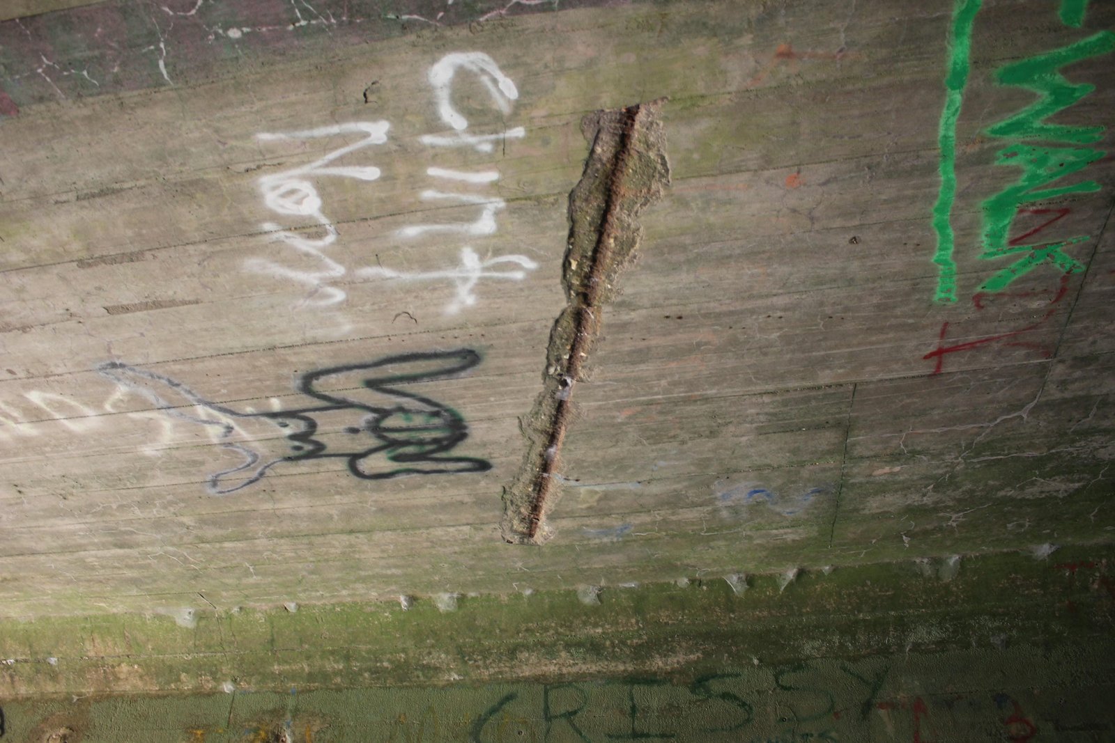 Exposed rebar under bridge
